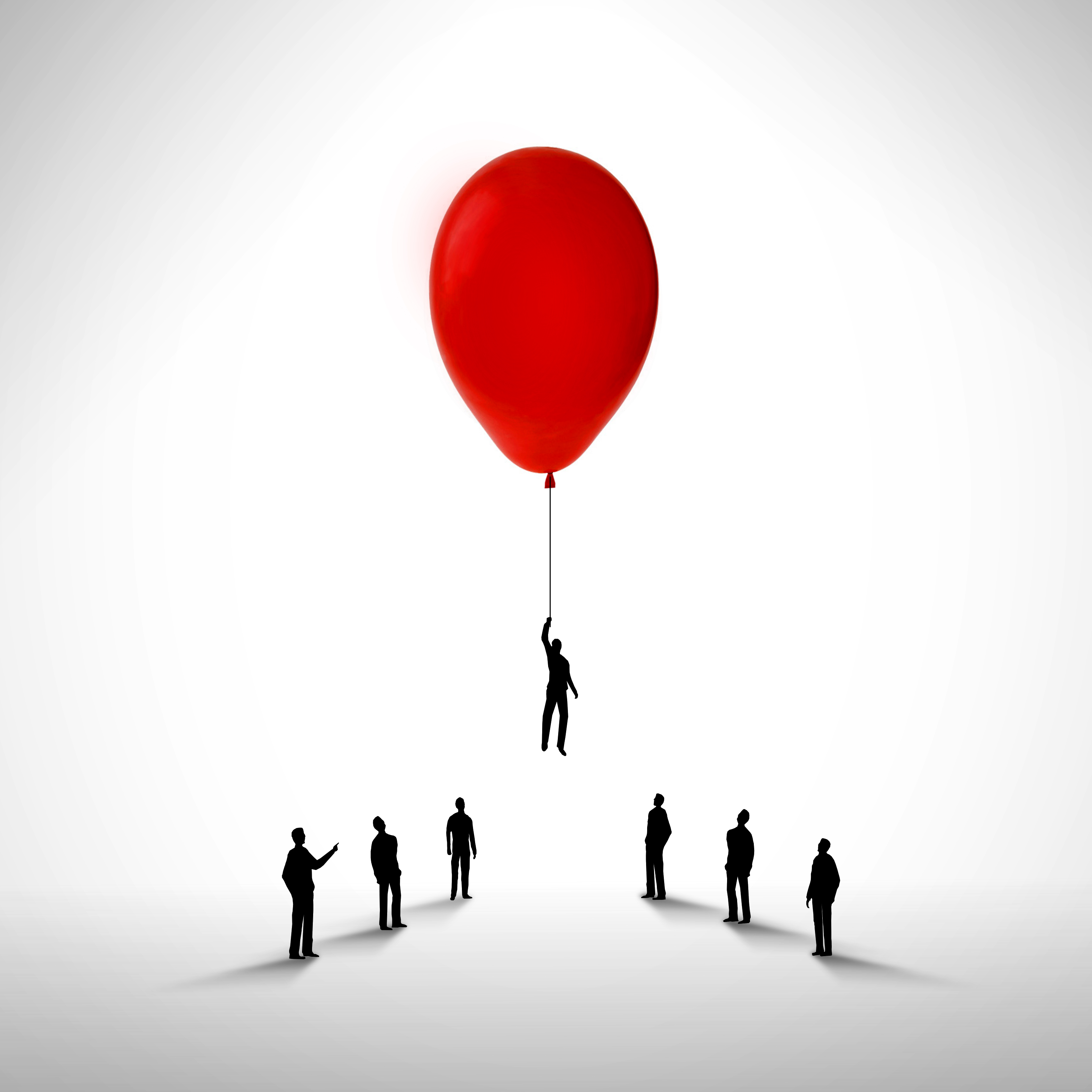 Businessman rising by holding a balloon - Promotion and career concept